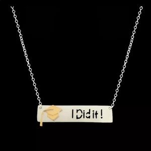 Silver “I Did It” graduation necklace.